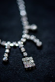 istock Diamond necklace on a black background 1372302892