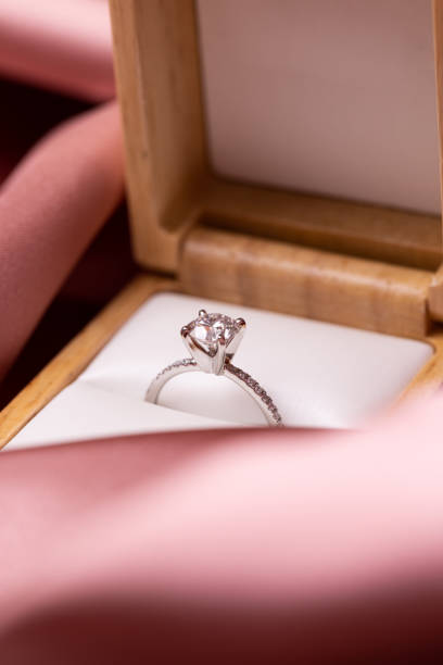 Diamond Wedding Ring Pink Fabric stock photo