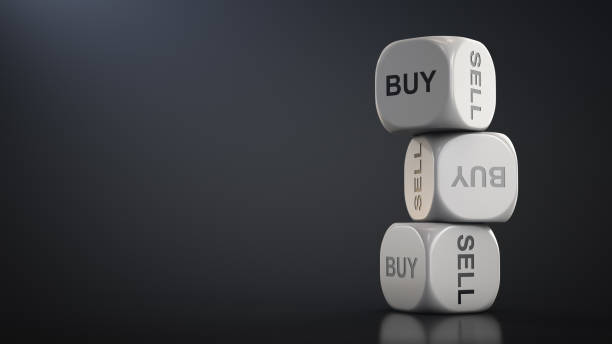 Dice with answer options: buy or sell. Financial solution concept stock photo