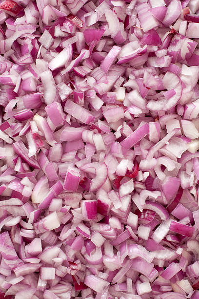 Diced red onion background Top view of chopped red onions chopped food photos stock pictures, royalty-free photos & images