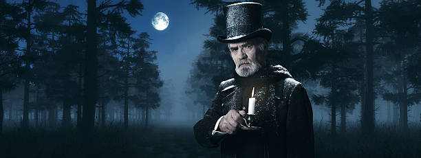 Dickens Scrooge Man with Candlestick in Foggy Winter Forest. stock photo