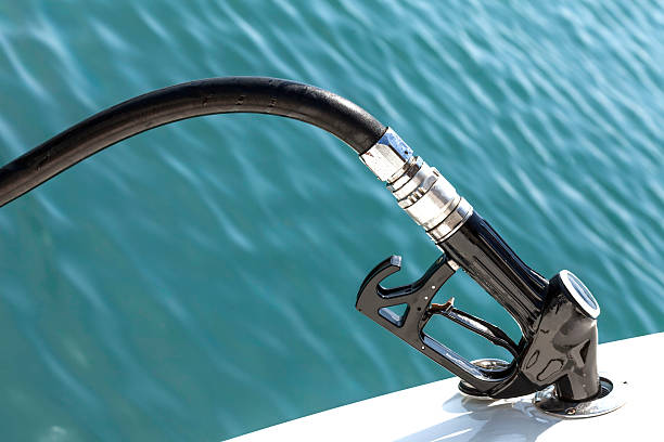 Diesel Pump Nozzle Refilling Boat stock photo