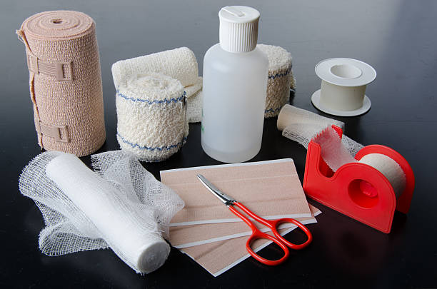 Different rolls of medical bandages and care equipment stock photo