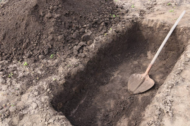 digging-a-pit-pit-in-the-ground-the-shovel-in-the-pit-picture-id1338385103