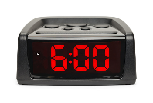 Black Plastic Alarm Clock With Red Display Isolated on White Background.