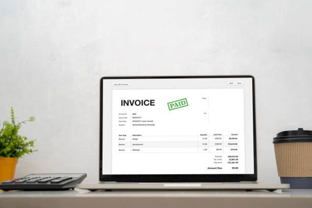 digital invoice online using computer calculator. stock photo