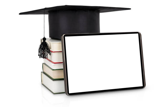 Digital tablet near the stack of books with graduation hat on the top isoalted on white Digital tablet with blank display near the stack of books with graduation hat on the top isoalted on white background. Education concept bachelor degrees stock pictures, royalty-free photos & images