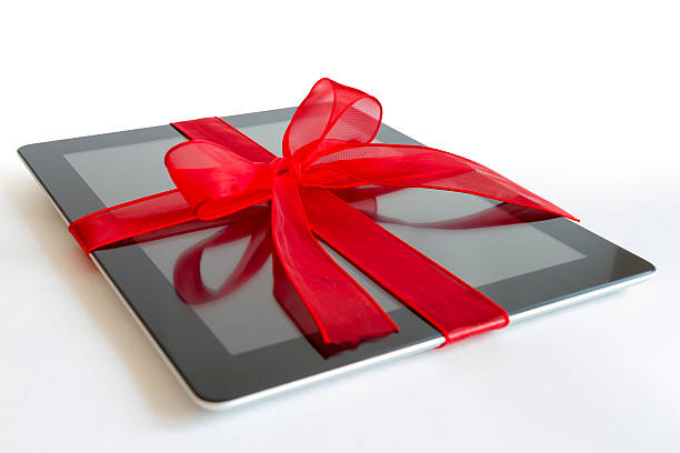 Digital tablet with red ribbon stock photo
