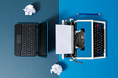 istock Digital und analog – Laptop and 80s Typewriter 1320906927