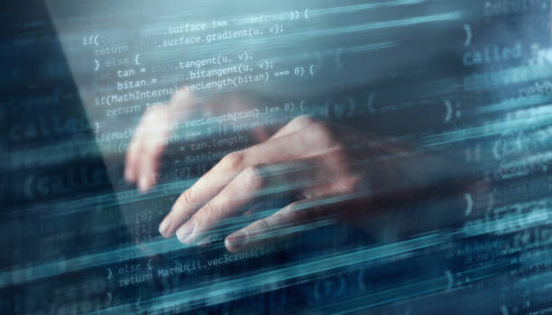 Digitally enhanced shot of an unrecognizable businessman's hands on a laptop keyboard superimposed over multiple lines of computer code stock photo