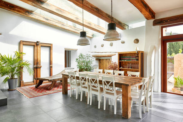 Dining area in refurbish a Spanish farmhouse Bright dining area in a refurbish Spanish farmhouse. roof beam stock pictures, royalty-free photos & images