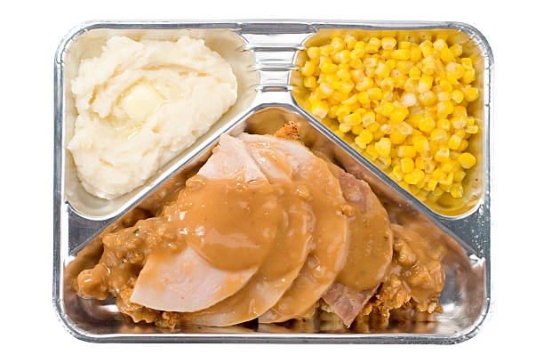 TV dinner with turkey and gravy, mashed potatoes, and corn stock photo