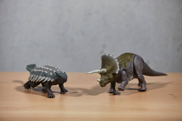 Dinosaur toys on wooden table. stock photo