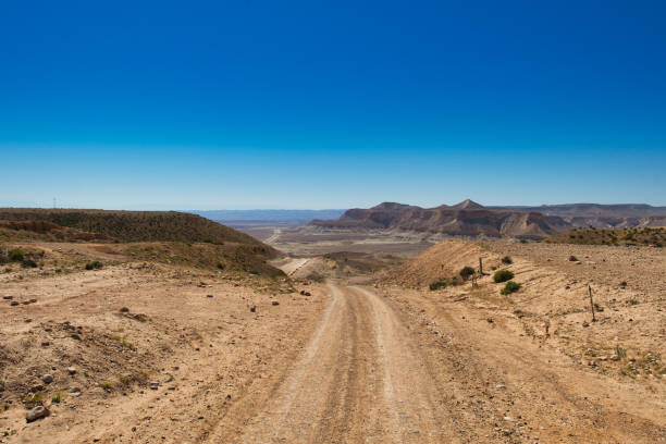 Dirt road entering the desert in Israel stock photo