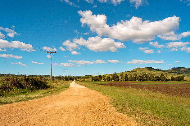 Dirt road through rural farming area in Queensland, Australia stock photo