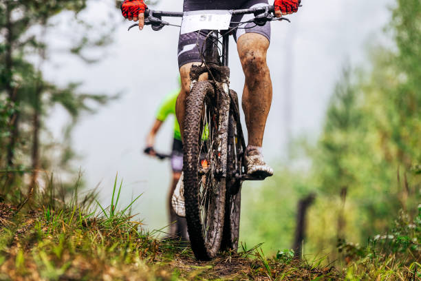 dirty feet cyclist athlete in mountain bike stock photo