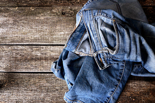 Dirty jeans on floor stock photo
