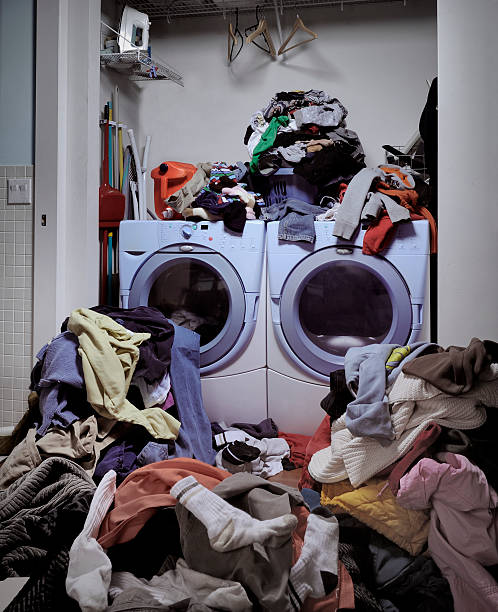 Dirty Laundry Overflowing of dirty laundry unhygienic stock pictures, royalty-free photos & images