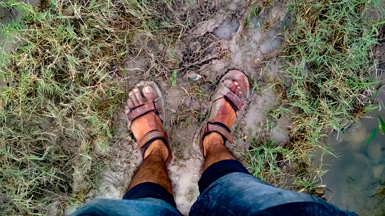Dirty Legs In Mud And Grass Stock Photo - Download Image Now - Adult