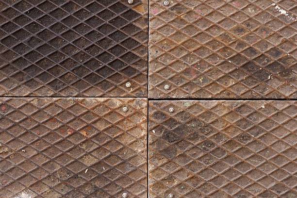 dirty metal plate diamond pattern on iron, fastening bolt stock photo