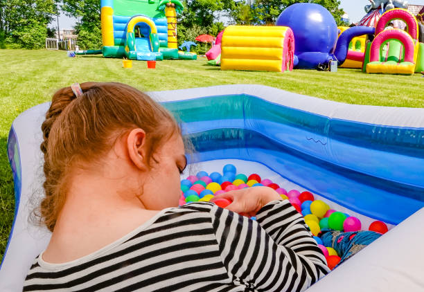 disability-a-disabled-child-relaxing-in-a-pool-with-lots-of-toy-balls-picture-id971360978?k=20&m=971360978&s=612x612&w=0&h=KZs2ua3My7ZHWLiTGj37tvMBmHiH-XC29tKN7Ms4M5g=