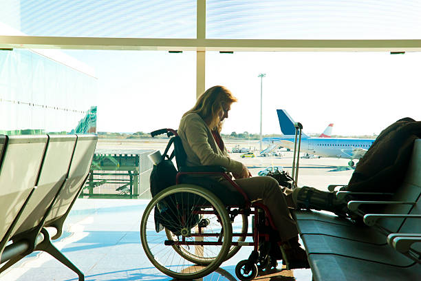 Disabled woman stranded at the airport stock photo