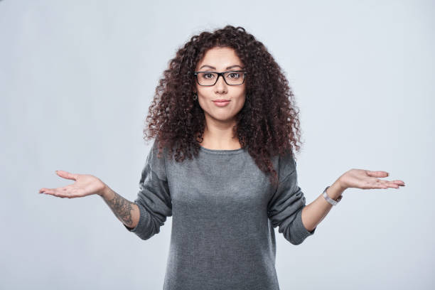 18 Woman Shrugs Shoulders With Palms Up And Astonished Expression Stock  Photos, Pictures & Royalty-Free Images - iStock