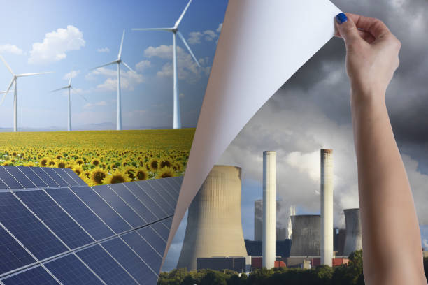 Discovering and using renewable energy resources instead of polluting power station chimneys stock photo