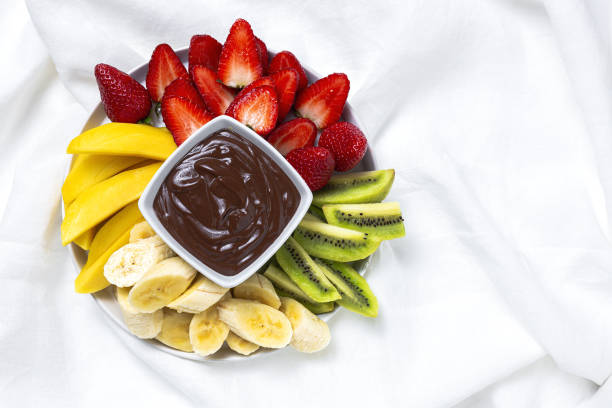 Dish of Fruits with chocolate ready to eat take away stock photo