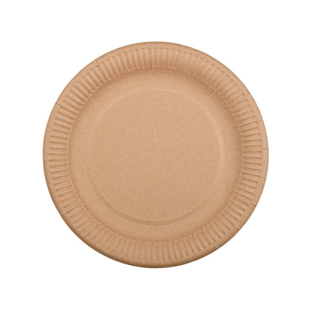 Disposable brown paper plate isolated on white stock photo