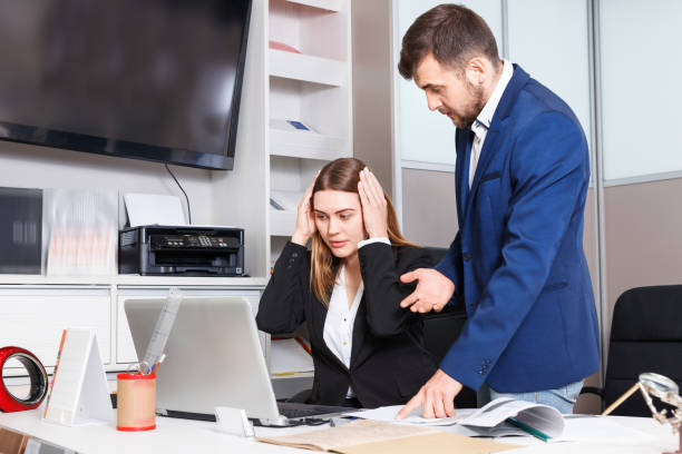 Dissatisfied manager scolding frustrated salesgirl at workplace in furniture salon Dissatisfied  unhappy manager scolding frustrated salesgirl at workplace in furniture salon salesgirl stock pictures, royalty-free photos & images