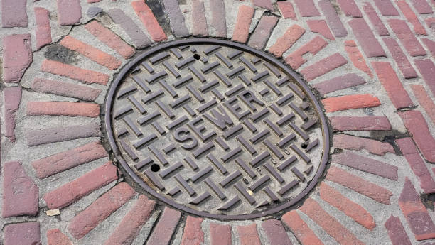 Distressed City Sewer Manhole Cover stock photo