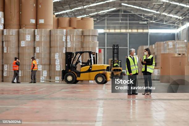 Distribution Center Managers and Workmen in Time of COVID-19