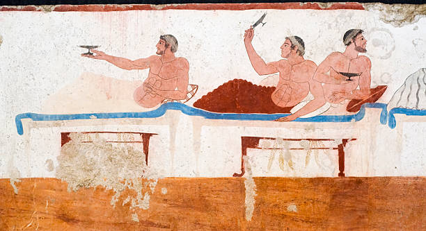 Diver's Tomb, Paestrum from Ancient Greece Ancient Greek Fresco in Paestum, Italy, called the "Tomb of the Diver" depicting men during a banquet. fresco stock pictures, royalty-free photos & images