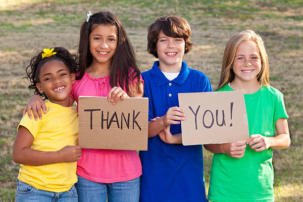 Diverse group of children holding Thank You signs Diverse group of children holding Thank You signs. thank you phrase stock pictures, royalty-free photos & images