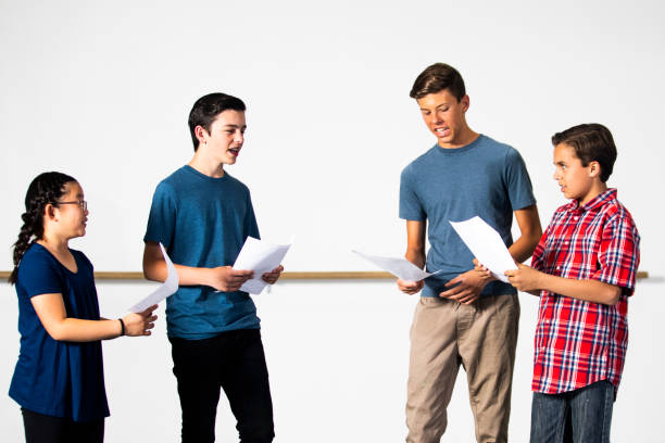 Diverse Group of Drama Students Practicing Play A group of diverse students reading lines for drama young male actors stock pictures, royalty-free photos & images