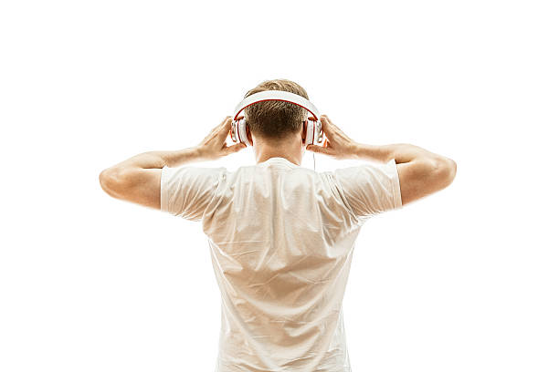 dj listening music with white headphones - retro look stock photo