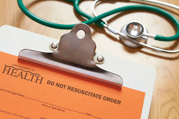 Do Not Resucitate Order On Clipboard With Stethoscope In Background stock photo
