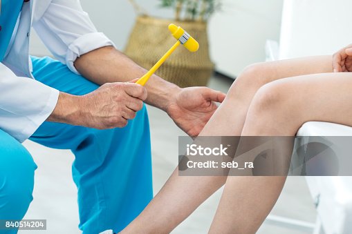 istock Doctor examining the knee reflex 840514204