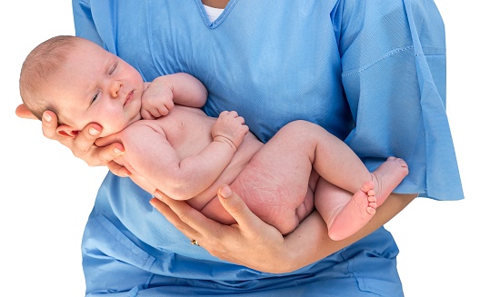 Doctor Holding A Beautiful Newborn Baby Stock Photo ...