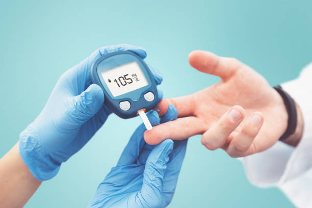 Doctor making blood sugar test. Diabetes treatment Doctor making blood sugar test in clinic for diabetes. Treatment and controlling diabetes concept glucose stock pictures, royalty-free photos & images