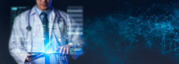 Doctor using computer and abstract graphics UI, modern medical health care and technology concept stock photo