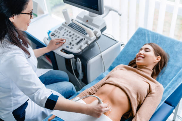 Doctor using ultrasound and screening woman's stomach Medicine, Hospital, Medical Clinic, Ultrasound, Doctor obstetrician photos stock pictures, royalty-free photos & images