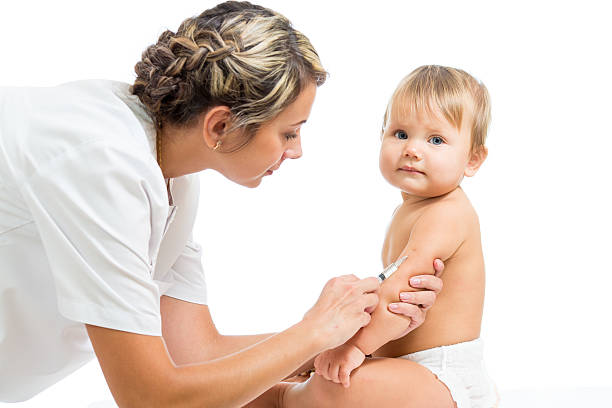 doctor vaccinating  baby isolated on a white background stock photo