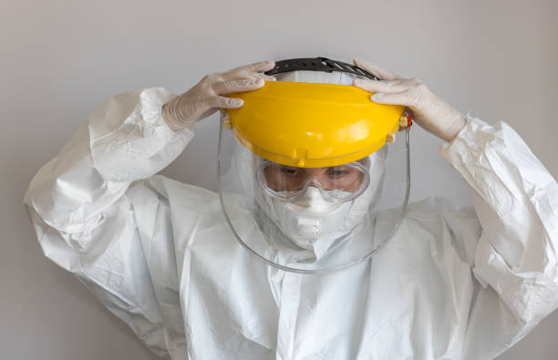 Doctor wearing her Protective Equipments stock photo