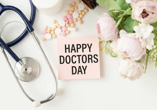 Doctor's Day concept. Medical apparatus such as stethoscope and spiral notepad with Happy Doctors' Day text on it. Flat lay view. Doctor's Day concept. Medical apparatus such as stethoscope and spiral notepad with Happy Doctors' Day text on it. Flat lay view. happy doctors day stock pictures, royalty-free photos & images