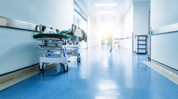 Doctors or nurses walking in hospital hallway, blurred motion stock photo