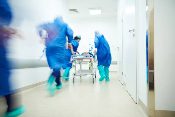Doctors running for the surgery Doctors running for the surgery accidents and disasters stock pictures, royalty-free photos & images