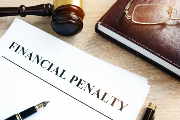 Document with title Financial penalty on a desk. Document with title Financial penalty on a desk. punishment stock pictures, royalty-free photos & images