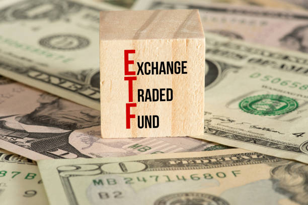 Dollar banknotes and ETF index funds stock photo